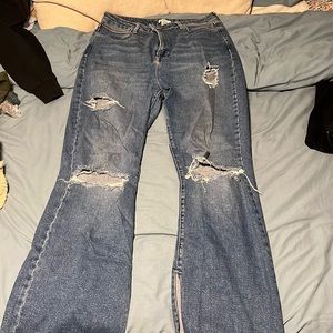 Medium wash, high waisted ripped blue jeans